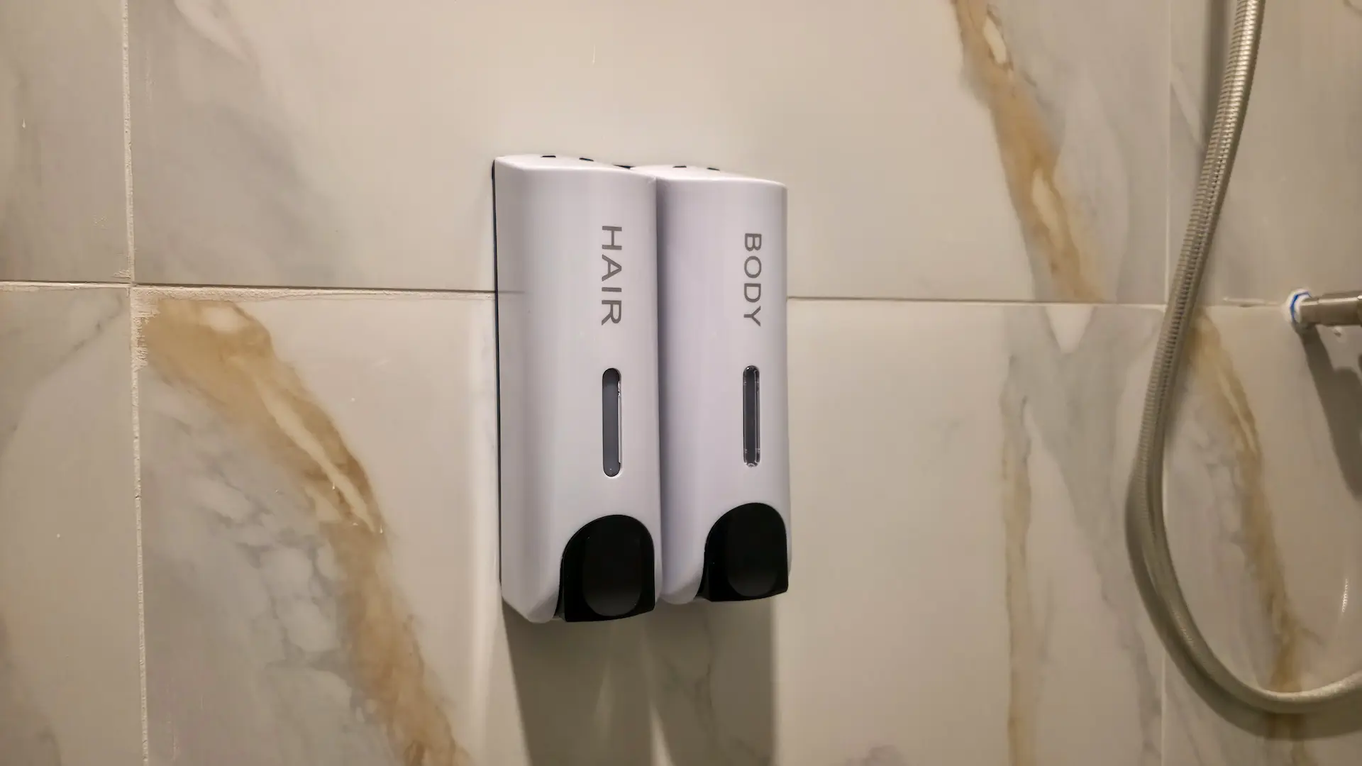 Refillable shampoo and soap dispensers at Mariden Resort