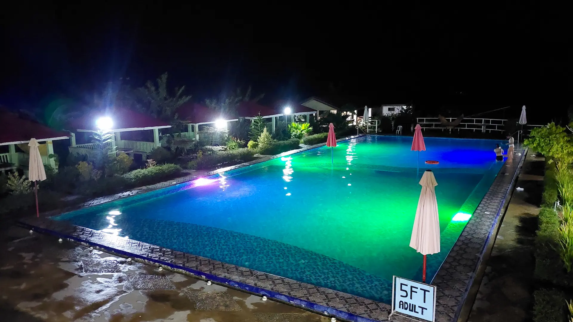 Swimming pool at night at Mariden Resort Del Carmen Siargao